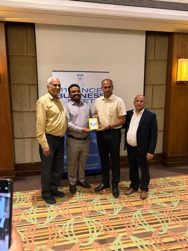 Certsure Certification representative receiving an award plaque from Shri Babloo Kumar, IPS, Joint Commissioner of Police, Lucknow, at the NCE Business Meet