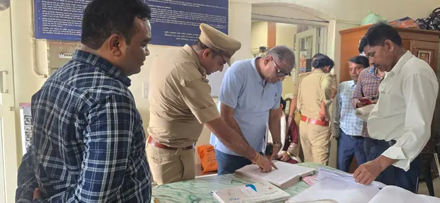 Certsure auditor reviewing police station registers with an officer during an ISO audit
